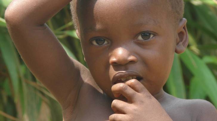 young african child in the woods