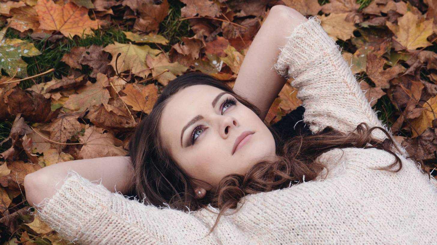 girl laying on her back looking at the sky