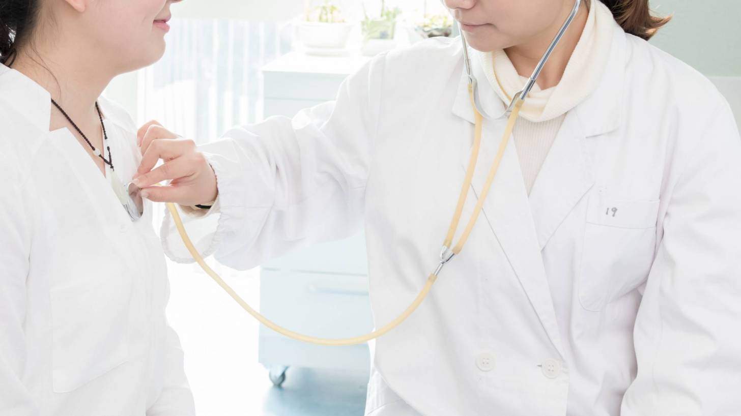 doctor listening to a patients chest